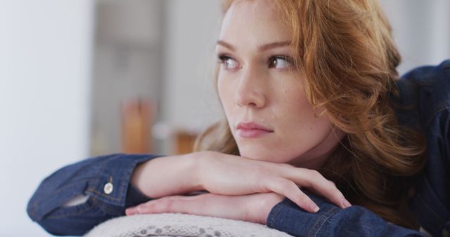 Pensive Redhead Woman with Chin Resting on Hands - Download Free Stock Images Pikwizard.com