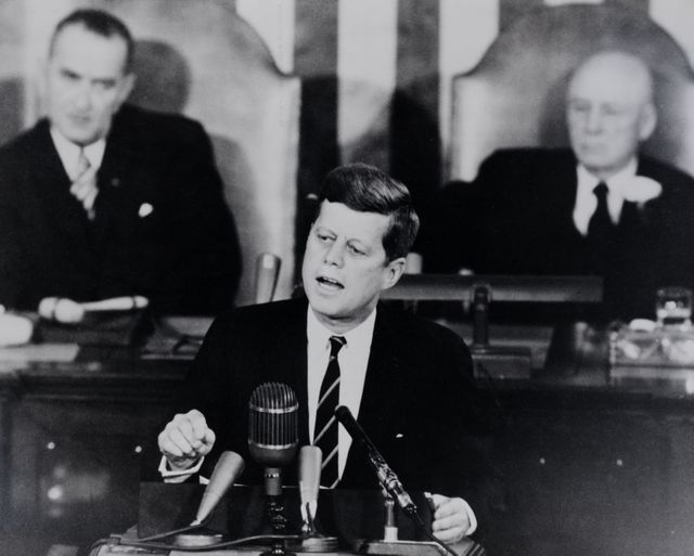 S70-18218 (25 May 1961)  --- View of President John F. Kennedy, with  Vice-President Lyndon B. Johnson. and Speaker of the House Sam Rayburn  behind him, addressing the Joint House of Congress,