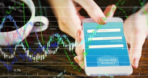 Tapping smartphone displaying banking login while viewing stock market candlestick chart