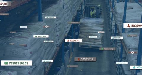 Warehouse forklift navigating aisle with labeled pallets and inventory tags for logistics