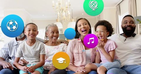 Smiling multigenerational family on couch with colorful icons for music, learning, sports