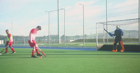 Teenage Field Hockey Players Training on Artificial Turf