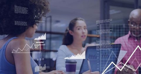 Diverse team analyzing financial data with digital graphs overlay