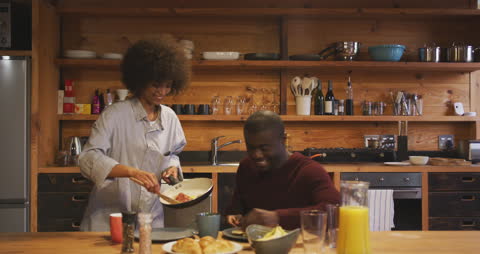 Cozy Breakfast at Home with Smiling Couple Enjoying Morning