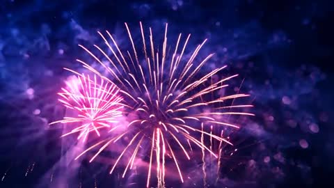 Bright Pink Fireworks Display on a Clear Night Sky