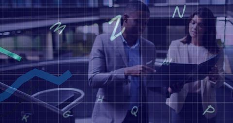 Business Professionals Analyzing Data Overlaid with Charts and Code