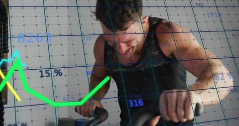 Muscular man pedaling hard on stationary bike with workout analytics overlay