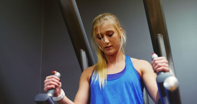 Young Woman Using Gym Equipment for Strength Training - Download Free Stock Images Pikwizard.com