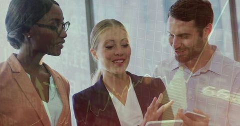 Business Team Discussing Financial Analytics with Devices in Modern Office