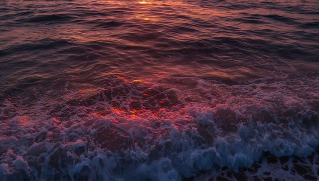 Golden Waves Reflecting Sunset at Seaside