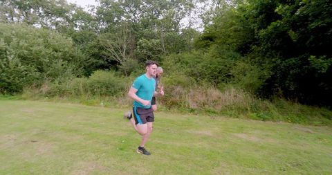 Two men jogging on scenic garden trail for healthy lifestyle