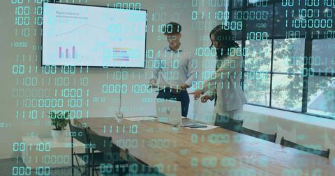 Business team reviewing data deck with binary overlay for cybersecurity and analytics