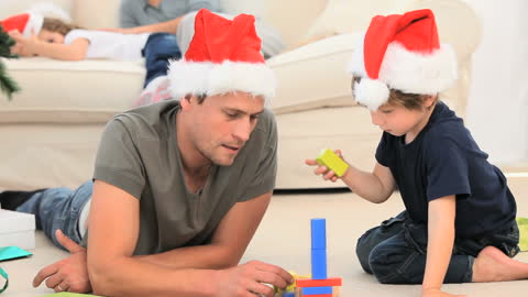 Father and Son Playing with Blocks During Christmas
