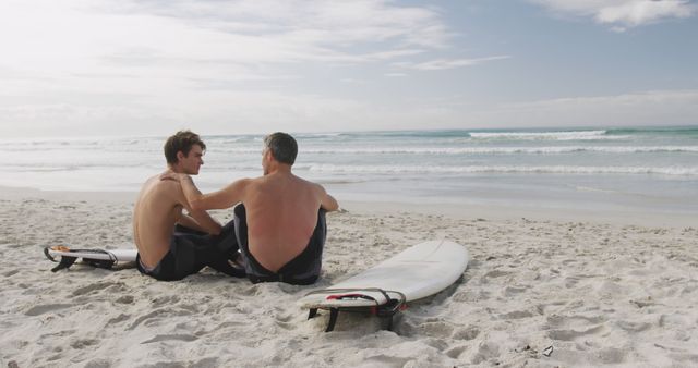 Father and Son Bonding on Beach with Surfboards - Download Free Stock Images Pikwizard.com