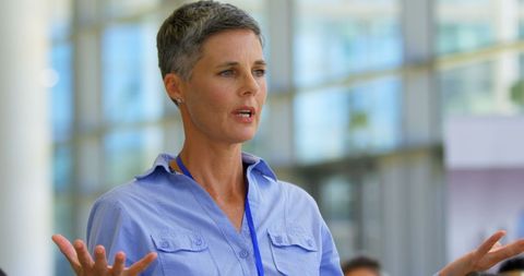 Confident Businesswoman Engaging at Seminar