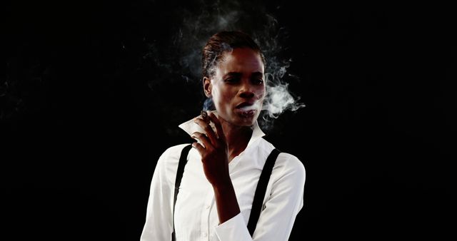 Confident Woman Smoking in White Shirt against Black Background - Download Free Stock Images Pikwizard.com