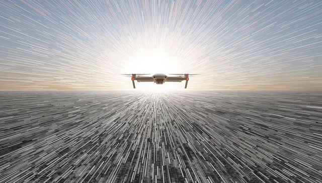 Hovering drone over abstract radial city grid toward sunrise with dynamic motion streaks