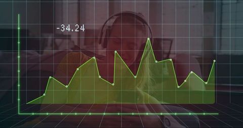 Woman Working on Laptop with Financial Data Graph Overlay