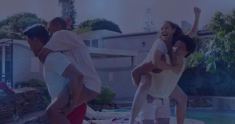 Couples Enjoying Summer Fun by Backyard Pool