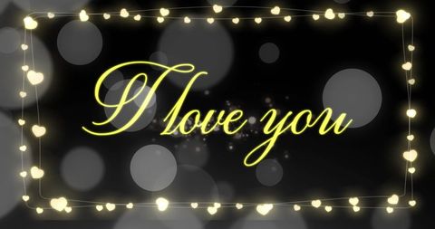 Romantic I Love You Text with Glowing Hearts and Bokeh Lights