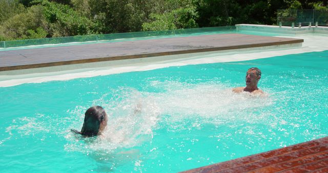 Two Adults Enjoying Splashing in Blue Swimming Pool on Sunny Day - Download Free Stock Images Pikwizard.com