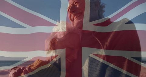 Elderly Couple Embracing on Seaside with Union Jack Overlay