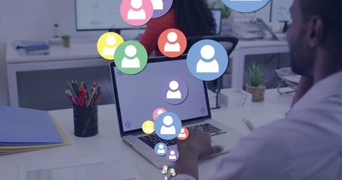 Man Collaborating on Laptop with Overlapping User Icons in Office