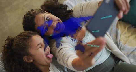 Mother and Daughter Share Fun Selfie with Global Data Visualized