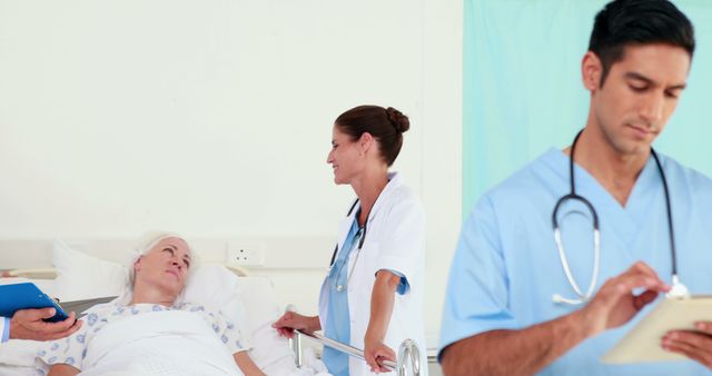 Healthcare Professionals Caring for Senior Patient in Hospital Room - Download Free Stock Images Pikwizard.com