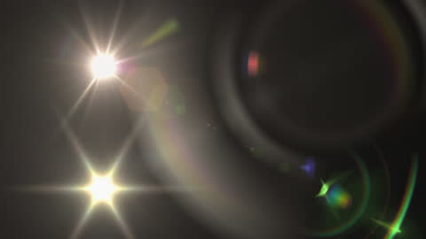 Luminous Lens Flare and Bokeh on Dark Background