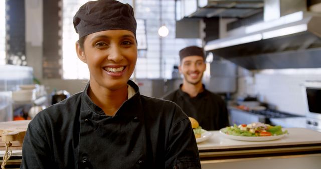 Smiling Chefs in Professional Kitchen - Download Free Stock Images Pikwizard.com