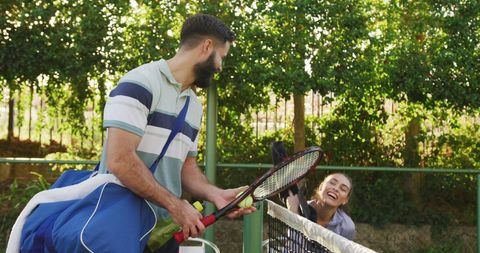 Cheerful Couple Enjoying Tennis Match Outdoors