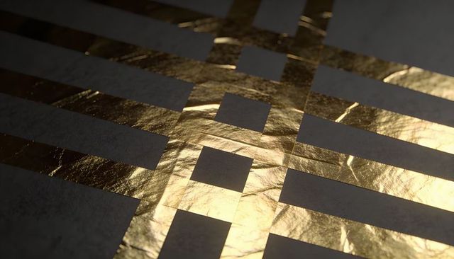 Crinkled gold foil grid revealing dark matte card geometric texture with reflective highlights