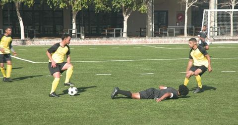 Diverse Soccer Team Competing on Outdoor Field