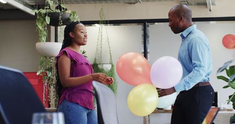 Colleagues Excitedly Preparing for Office Celebration