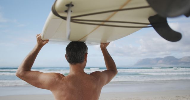 Man Carrying Surfboard on Sunny Beach Ready to Surf - Download Free Stock Images Pikwizard.com