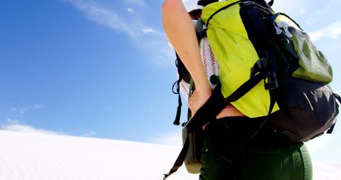 Hiker Exploring Desert Landscape Under Clear Blue Sky - Download Free Stock Images Pikwizard.com