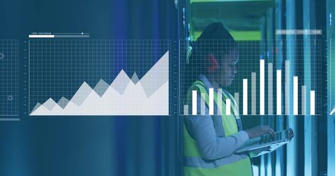 It professional analyzing data trends near computer servers