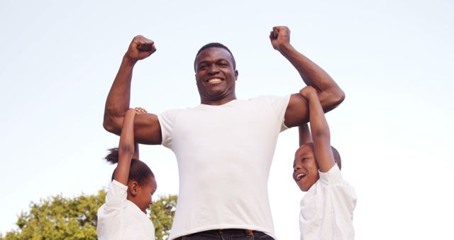 Happy African American Father Lifting Children in Park - Download Free Stock Images Pikwizard.com