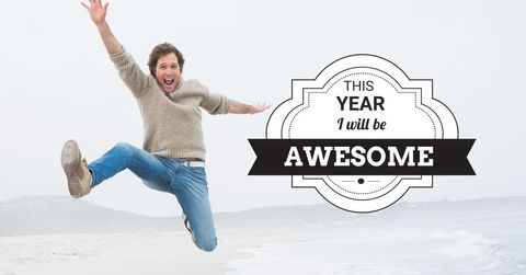 Joyful person leaping with motivational message by the sea