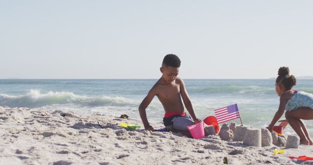 Children Playing on Coastal Beach Building Sandcastles - Download Free Stock Images Pikwizard.com