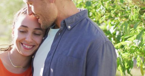 Young Couple Embracing in Peaceful Outdoor Environment