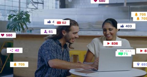 Collaborative Teamwork in Modern Cafe with Social Media Icon Overlays