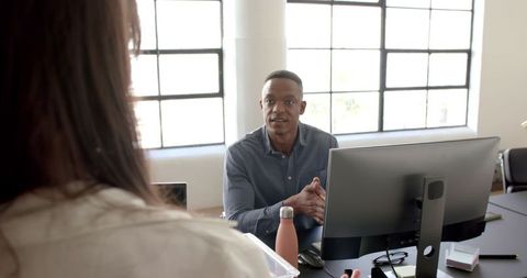 Professional discussion in bright office environment