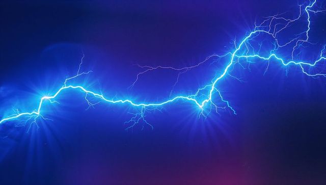 Neon blue lightning on electric digital sky