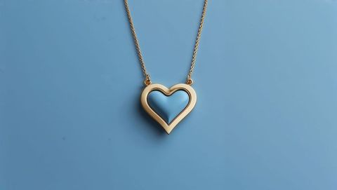 Elegant gold heart-shaped pendant with minimalist style