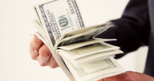 Close-Up of Businessman Hand Holding American Dollar Bills - Download Free Stock Photos Pikwizard.com