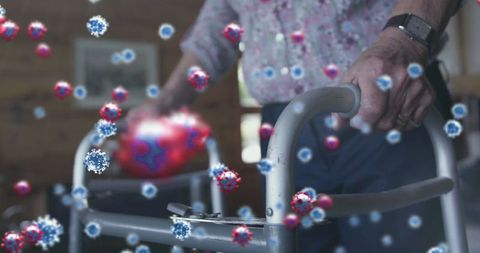 Senior Using Walker at Home with Virtual Viruses