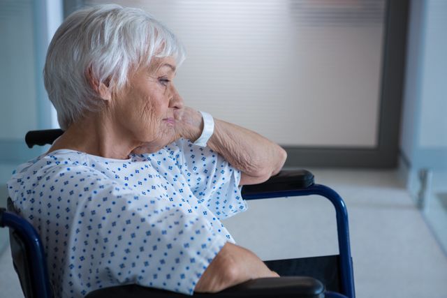 Elderly Woman in Wheelchair in Hospital Corridor - Download Free Stock Photos Pikwizard.com