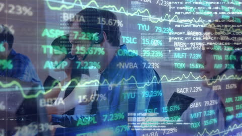 Business Team Analyzing Financial Data on Screens